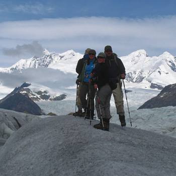 Hiker crossing Gates glacier in Wrangell St. Elias National Park, Alaska