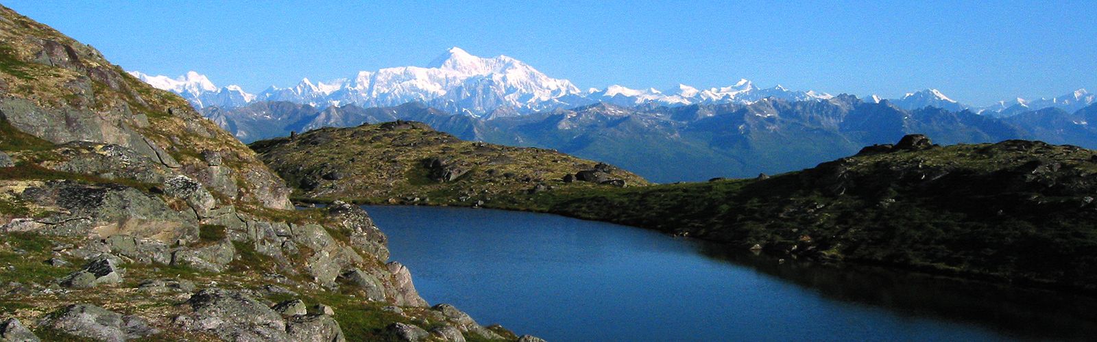 Summit of Denali seen from lake on Kesugi Ridge in Denali State Park, Alaska