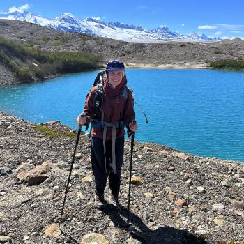 Backpacker at Fan Glacier Lake, Wrangell St. Elias National Park, Alaska