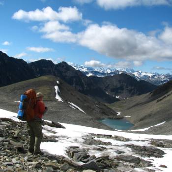 Hikers on high pass Seven Pass route in Wrangell St. Elias National Park, Alaska